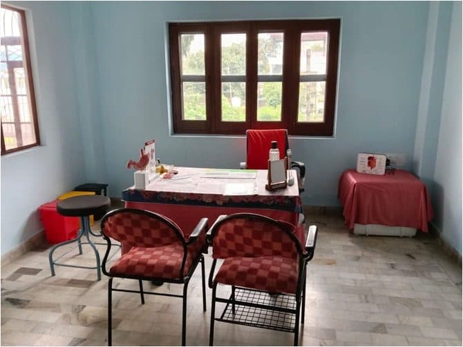 Consultation room with seating for patients at Vishvaas Clinic