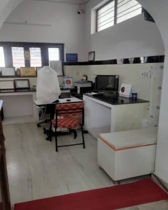 Consultation room with workspace at Vishvaas Clinic
