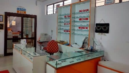 Optical dispensing counter with eyewear display at Vishvaas Clinic